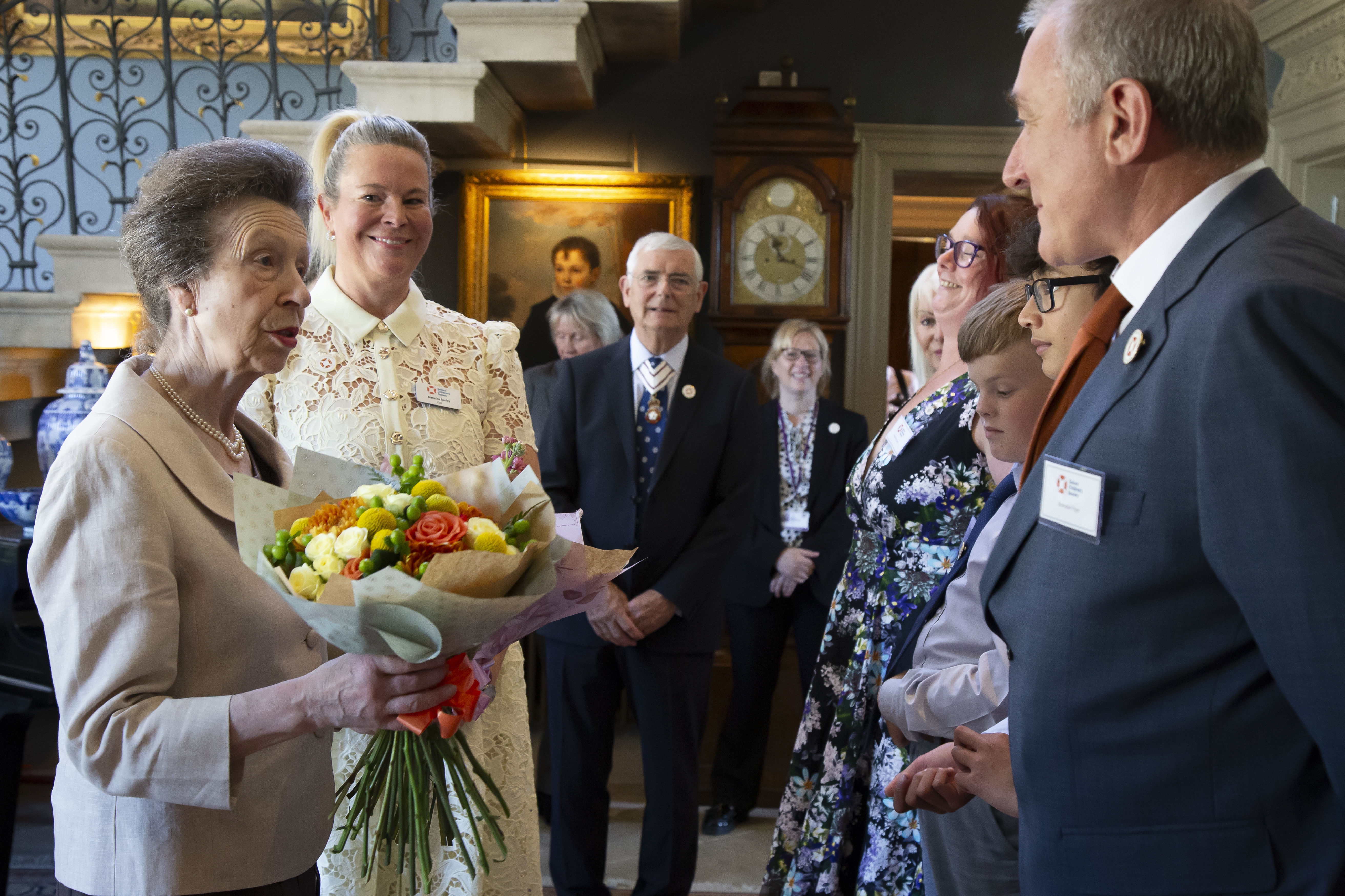 HRH presented with flowers from the children